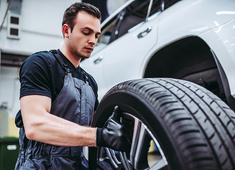 technician repairing tire